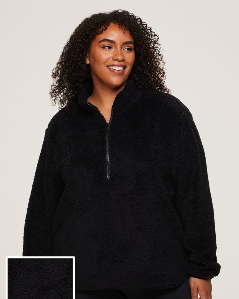 Front of a model wearing a size 1X Dylan 1/4-Zip Sherpa Pullover in Black by RBX Active. | dia_product_style_image_id:244563